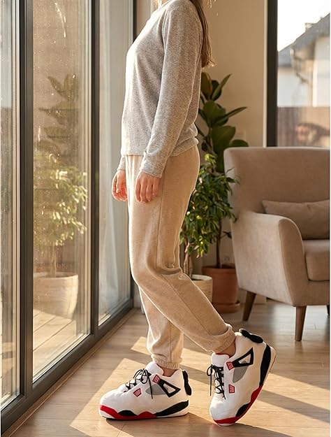 White sneaker style slippers worn indoors at home